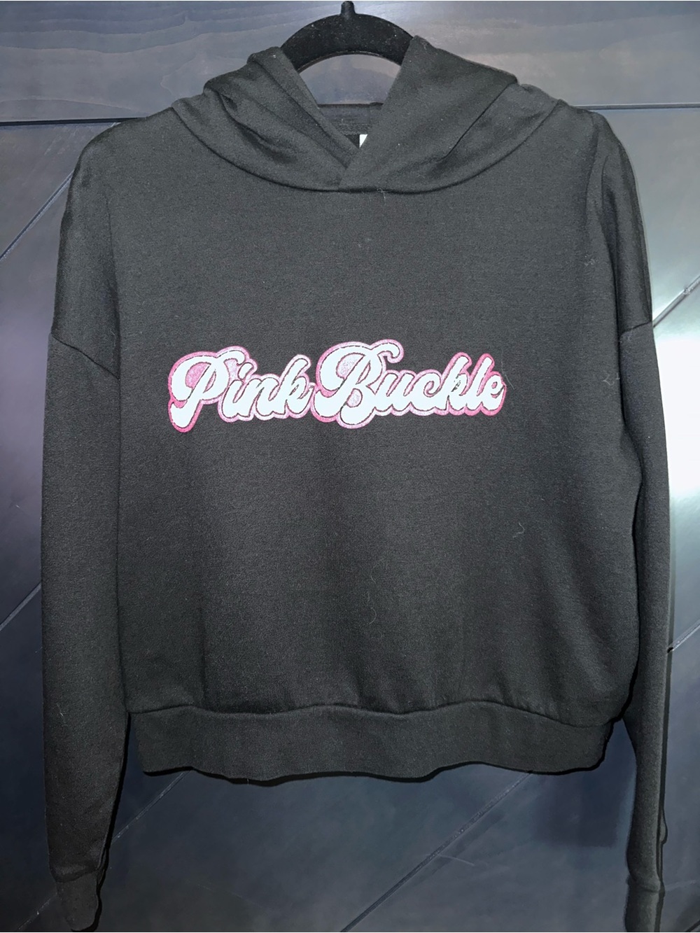Ruby Buckle Black Hoodie with Varsity Lettering